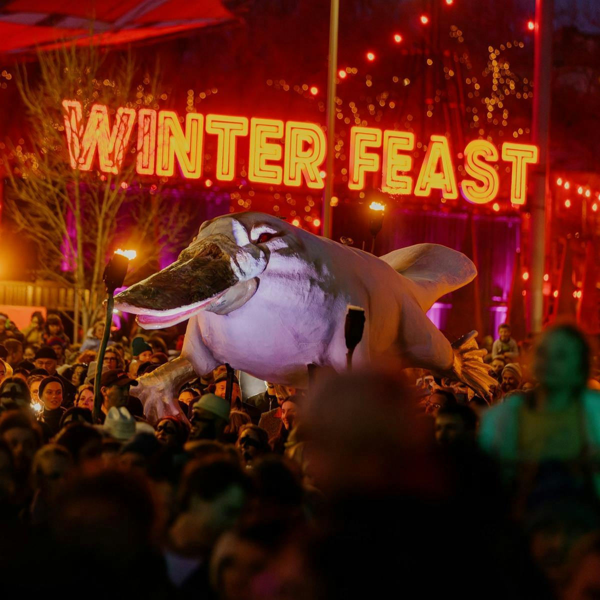 A big platypus being carried by hundreds of people