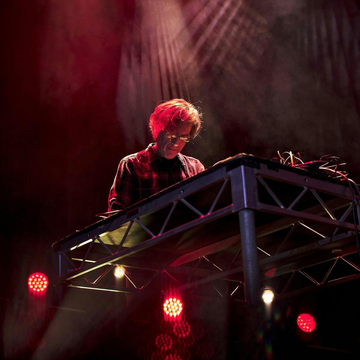 Thurston Moore looks down at his music table.