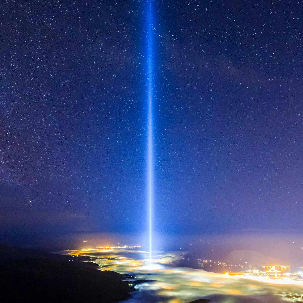 The beam of 'spectra' reaches into the night's sky above Hobart.